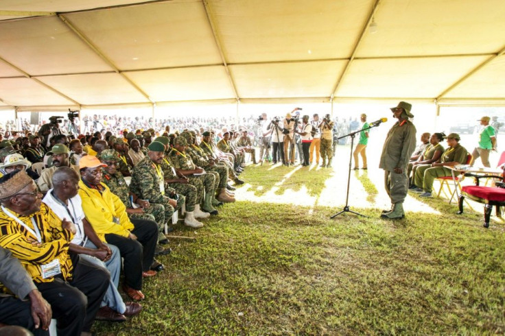 Ugandan President Yoweri Museveni and veterans and Members of Parliament, ready to march through the jungle as he retraces the route which his rebel forces took 35 years ago