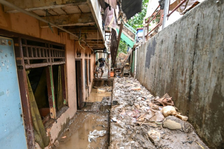 Indonesia's disaster agency said the death toll from the heavy flooding had climbed to 60