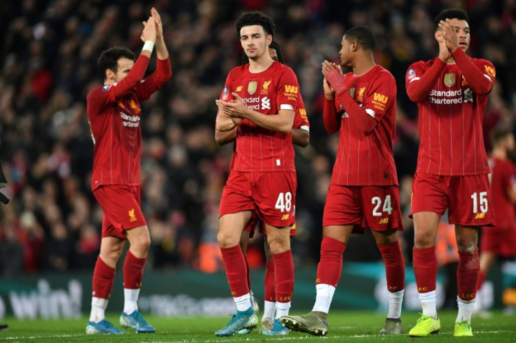 Goalscorer Curtis Jones (2nd L) celebrates with teammates after he fired Liverpool to a 1-0 win in their FA Cup third round match against Everton