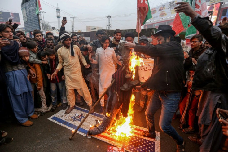 Pakistan Shiite Muslims burn an effigy of US President Donald Trump during a protest against the US strike that killed Iranian commander Qasem Soleimani