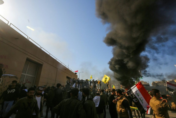 Iraqi protesters burning tires in front of the US embassy building in Baghdad: the US said that Russia and China's failure to condemn the attack undermined the credibility of the UN Security Council, of which they are permanent members