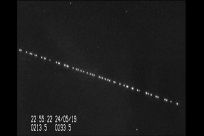 In this screengrab taken from a video shot by Marco Langbroek, a group of SpaceX Starlink satellites pass over Leiden, Netherlands on May 24, 2019