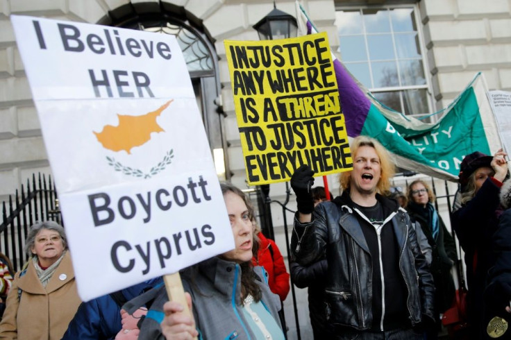 Demonstrators call for a boycott on Cyprus in support of a British teenager convicted of lying about being raped by Israeli tourists