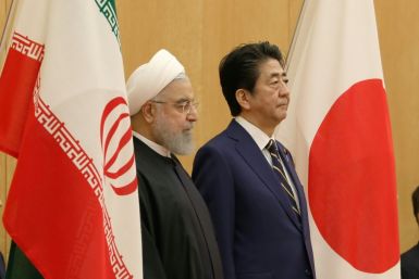 Japanese Prime Minister Shinzo Abe (R) with Iranian President Hassan Rouhani in Tokyo in December 2019. Tokyo and Tehran have longstanding ties and Abe is hoping to help ease regional tensions with his trip to Saudi Arabia, Oman and the UAE