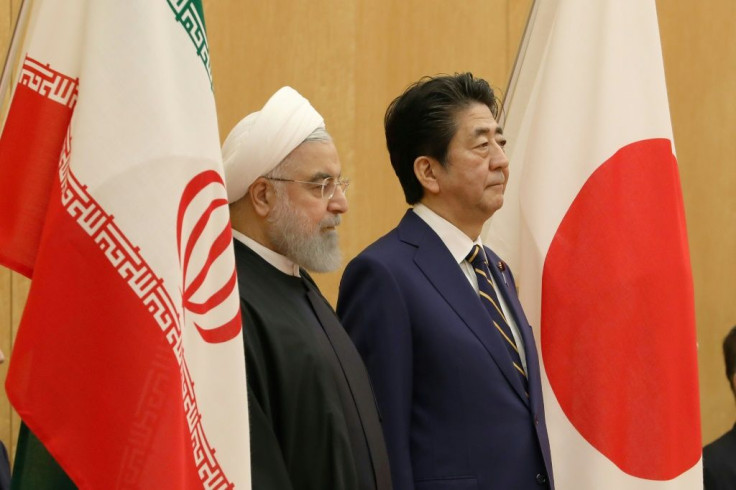 Japanese Prime Minister Shinzo Abe (R) with Iranian President Hassan Rouhani in Tokyo in December 2019. Tokyo and Tehran have longstanding ties and Abe is hoping to help ease regional tensions with his trip to Saudi Arabia, Oman and the UAE