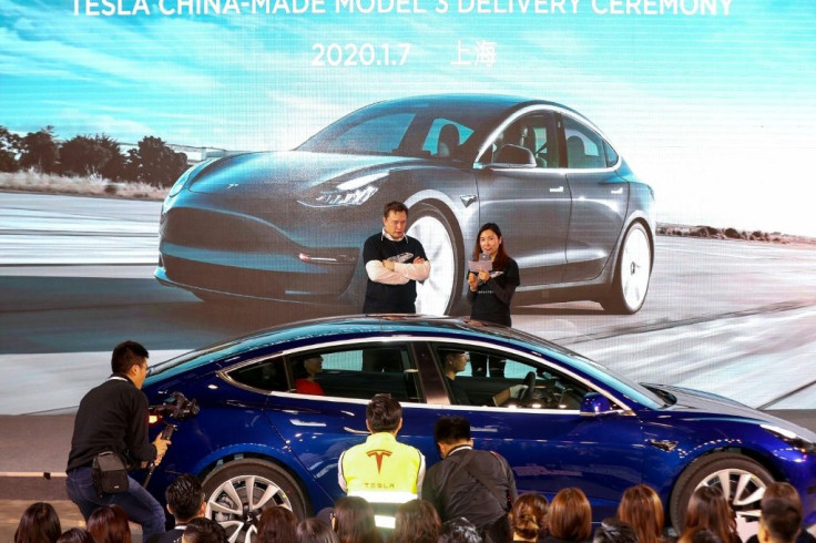 Elon Musk oversaw the delivery to customers of the first batch of made-in-China Tesla Model 3 cars