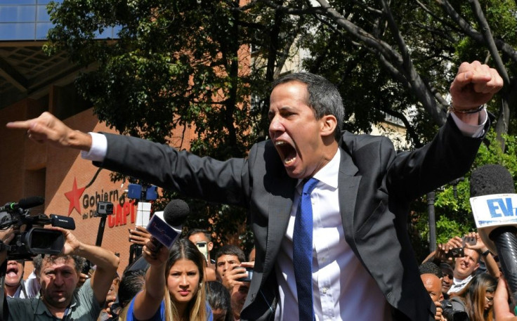 Venezuelan opposition leader and self-proclaimed acting president Juan Guaido shouts on his way to the National Assembly, in Caracas, on January 7, 2020, where he claimed the speaker's chair