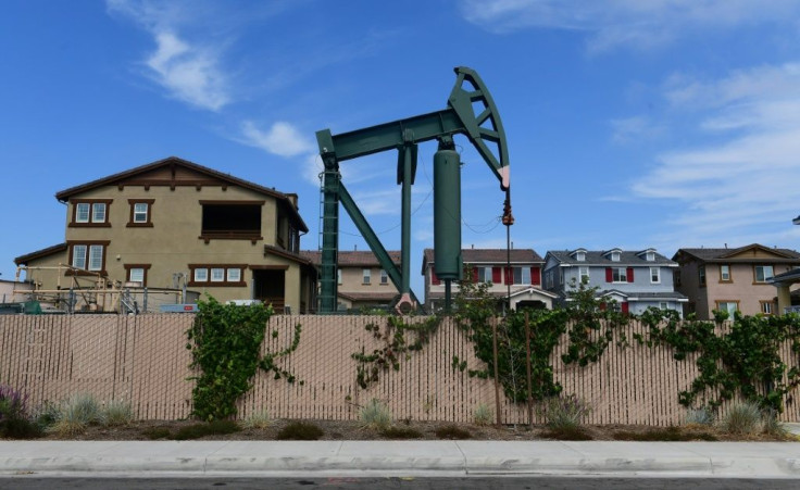 A pumpjack stands out among homes in residential Signal Hill, south of Los Angeles, California