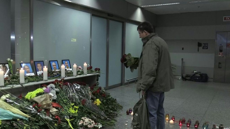 IMAGESUkrainians mourn the victims of the crash of a Ukraine International Airlines aircraft, laying flowers at a makeshift memorial at the plane's intended destination, Boryspil International Airport outside Kiev. The airliner crashed after take-off from