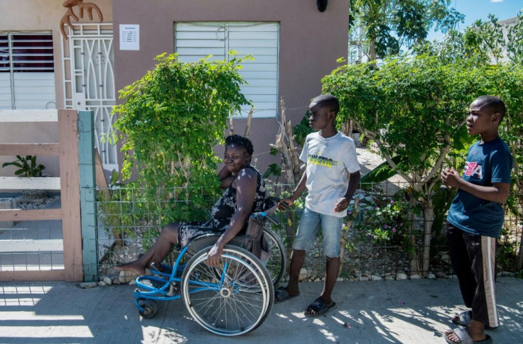 Herlande Mitile has relied on her daughters and their neighbors to help her get by in the aftermath of Haiti's devastating quake