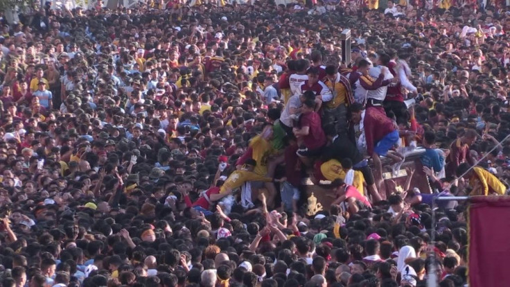 Swarms of barefoot believers throng a revered icon of Jesus Christ in Manila for a slow-moving and raucous procession considered one of the world's largest shows of Catholic fervour.