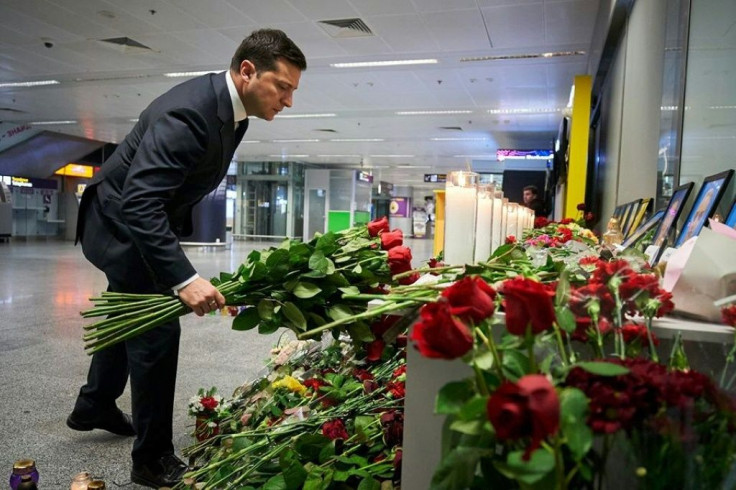 Zelensky laid a bouquet of roses at an impromptu memorial to the Ukrainian crew members who died in the crash