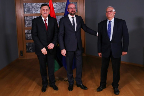 Libya's prime minister Fayez Al-Sarraj (L) with European Council President Charles Michel (C) and European Union foreign policy chief Josep Borrell before their meeting in Brussels