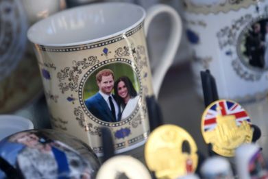 Royal memorabilia featuring Britain's Prince Harry, Duke of Sussex, and Meghan, Duchess of Sussex is displayed in a souvenir shop in Windsor, west of London