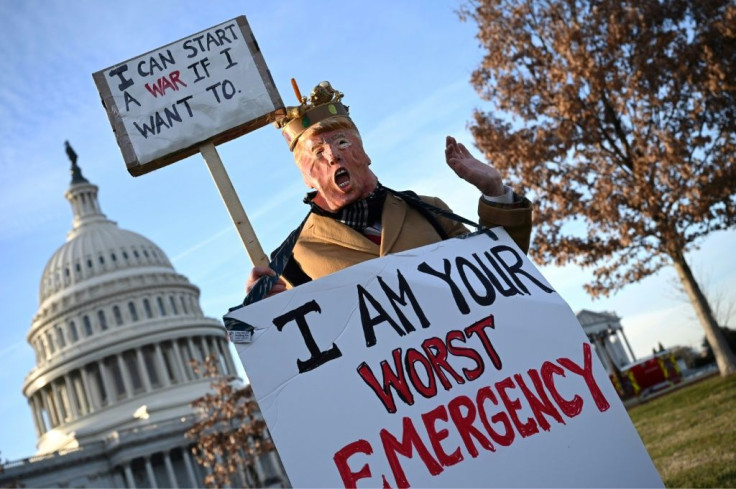 A demonstrator dressed as US President Donald Trump stands in front of the US Capitol to rally against war with Iran