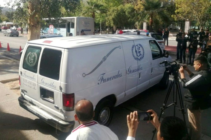A funeral van leaves the Mexican school where a student shot and killed a teacher