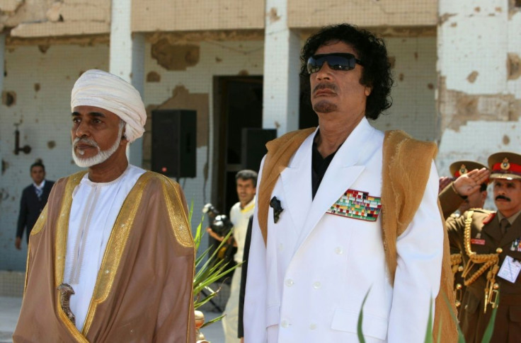 Qaboos and late Libyan leader Moamer Kadhafi standing for their national anthems in Tripoli in August 2008