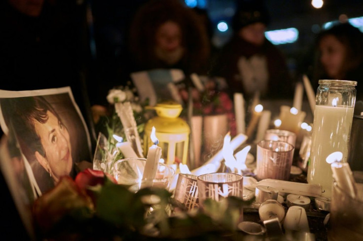 A photo of one of the victims of the plane crash is seen at a vigil in Toronto