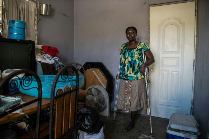 This file photo taken on December 30, 2019 shows Antonise Blan, 34, at home in the Haitian city of Croix des Bouquets; she lost her leg in the 2010 earthquake