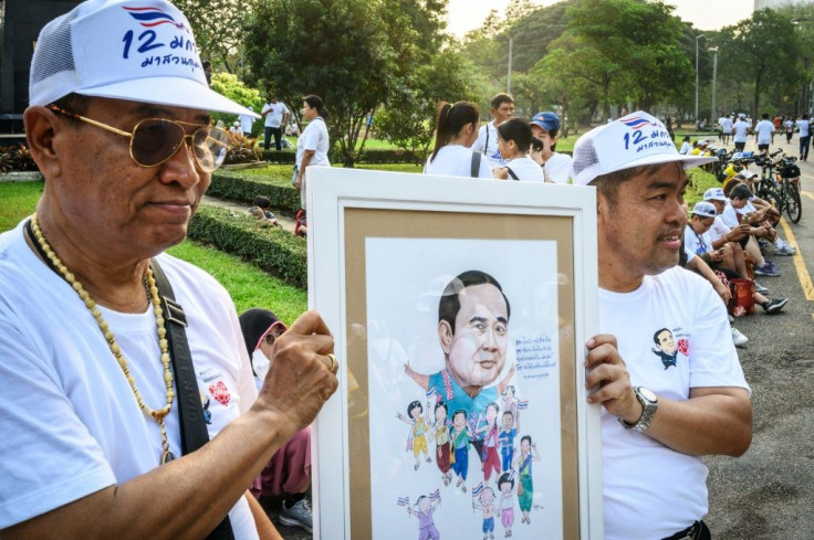 A smaller, rival 'Walk to Support Uncle' rally took place in another park at the same time