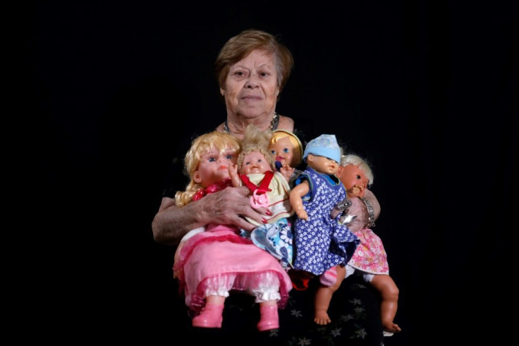 Malka Zaken, 91, says being with her dolls reminds her of being a child at home when her mother used to buy her dolls