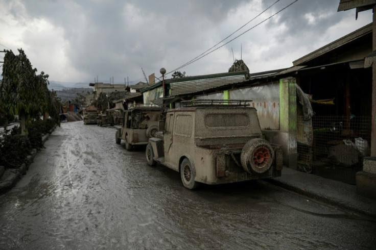 Vehicles covered in ash in Talisay town, south of Manila