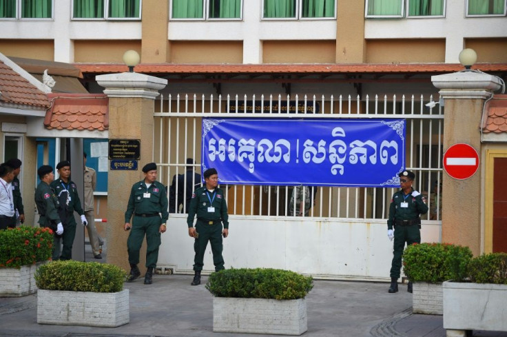 Police officers surrounded Phnom Penh Court on Wednesday as Cambodian opposition leader Kem Sokha arrived for his treason trial
