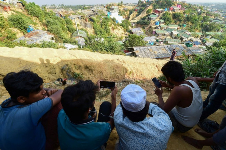 Rohingya refugees in Bangladesh watch a live feed of Aung San Suu Kyi's appearance at the UN