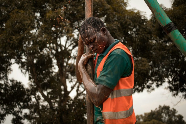 A former child soldier works on drilling a borehole in Bangui, part of a vocational programme for young victims of the Central African Republic's long conflict