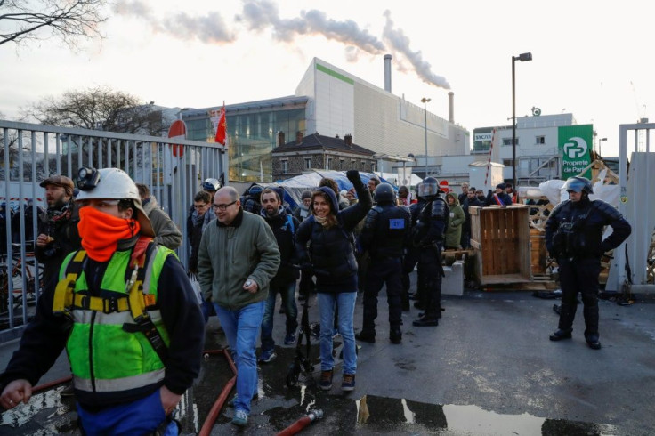 Strikers were evacuated by police after blockading a waste incinerator on the outskirts of Paris