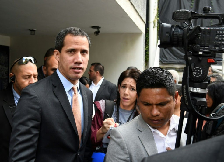 Lawmakers supporting Venezuelan opposition leader and self-proclaimed acting president Juan Guaido (C) say that pro-government loyalists opened fire at them