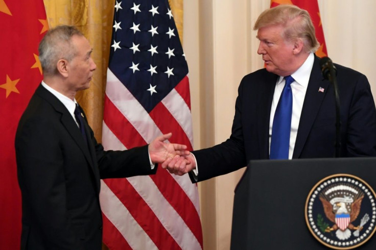 US President Donald Trump, shakes hands during a press conference with Chinaâs Vice Premier Liu He(L), the countryâs top trade negotiator, before they sign a trade agreement between the US and China during a ceremony in the White House