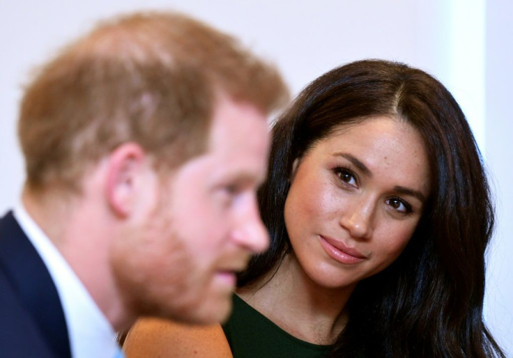 Britain's Prince Harry, Duke of Sussex (L) and Meghan, Duchess of Sussex are pictured in October 2019