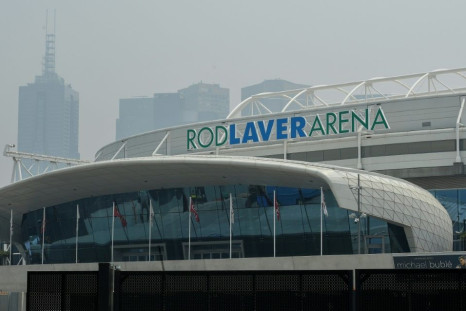 Smoke haze from unprecendented bushfires hovers over the Rod Laver Arena ahead of the Australian Open in Melbourne on Tuesday