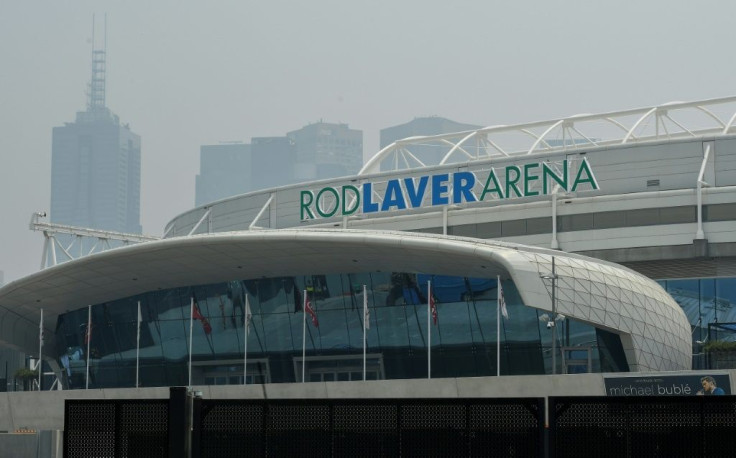 Smoke haze from unprecendented bushfires hovers over the Rod Laver Arena ahead of the Australian Open in Melbourne on Tuesday