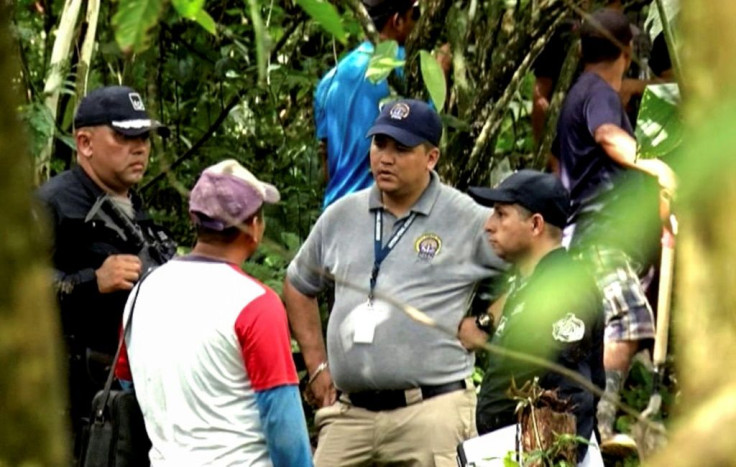 Panamanian police and prosecution officials near the site of a mass grave found in the indigenous region of Ngabe Bugle west of Panama City