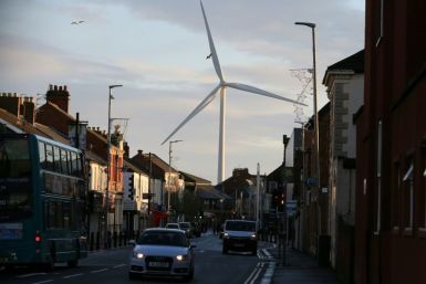 A wind turbine looms over Blyth, northeast England on December 13, 2019; Turnover in Britain's low carbon and renewable energy sector expanded 15.5 percent to Â£46.7 billion ($60.8 billion, 54.6 billion euros) in 2018 compared with 2015
