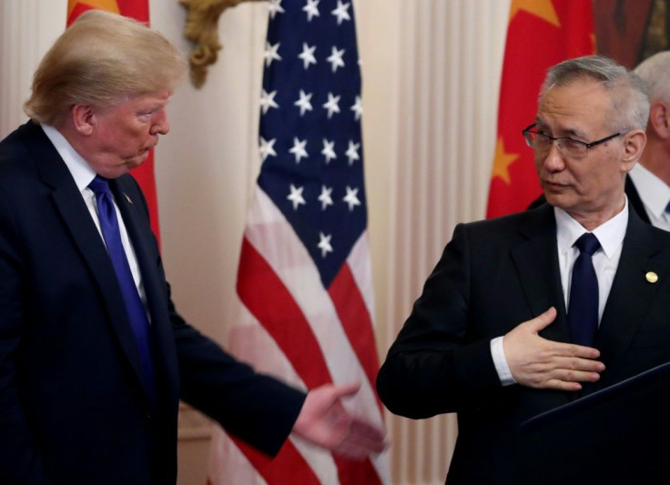 President Donald Trump stands with Chinese Vice PremierÂ LiuÂ He, before signing a preliminary trade deal between the US and China