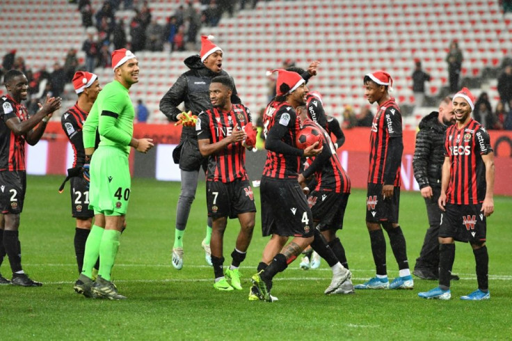 Nice celebrate their win with the offending festive hats