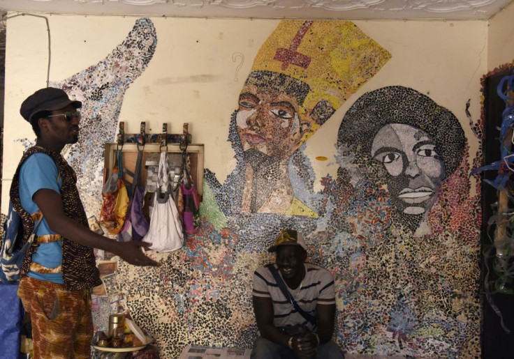 Mamadou Boye Diallo((L), the founder of the Yataal Art fair, is also a local guide