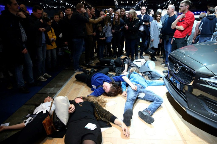 The protests staged a series of separate actions, including this 'die-in', at different stands of the motor show