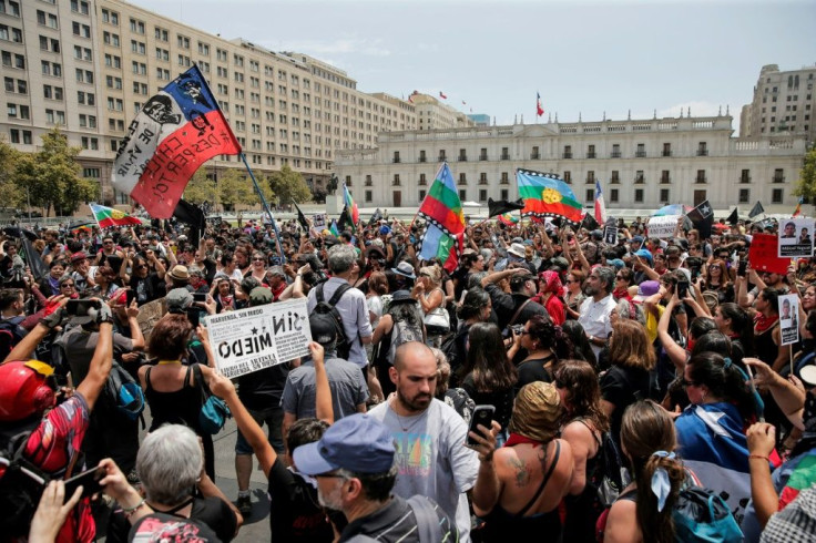 Chileans march against police repression outside the presidential palace