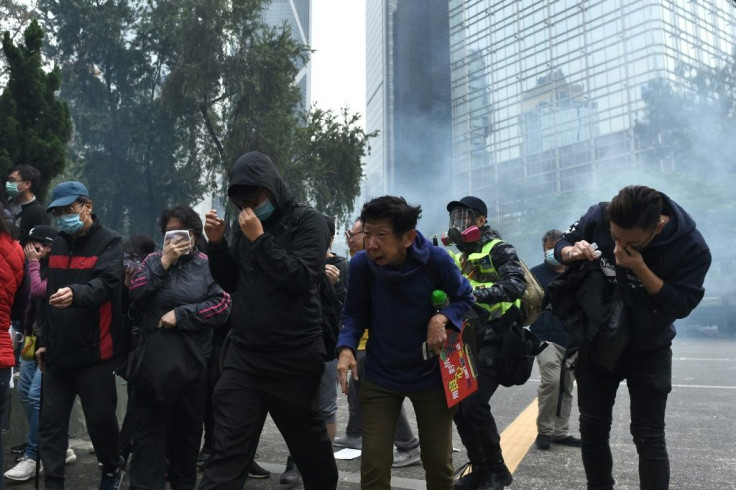 Riot police swept into the area and fired tear gas to disperse the crowds