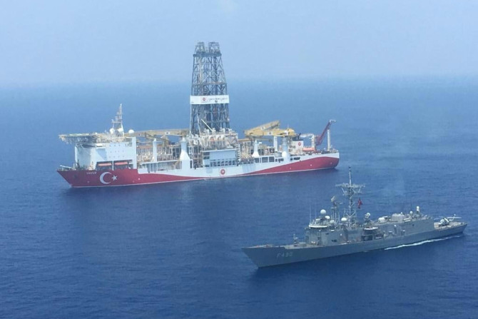 A Turkish navy warship patrols next to Turkey's drilling ship 'Fatih' sent to waters off Cyprus