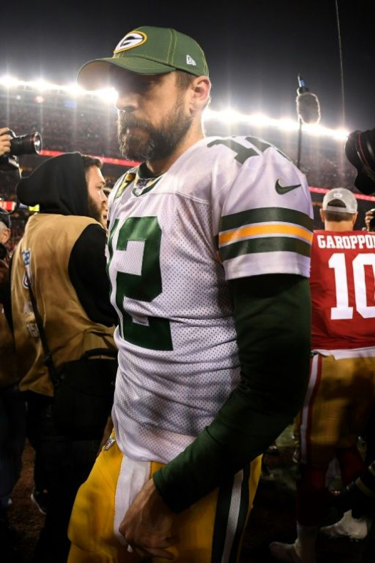 Green Bay great Aaron Rodgers walks off the field after the Packers came up short in the NFL's NFC Championship game against the San Francisco 49ers