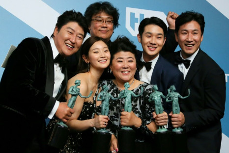 "Parasite" cast (L-R) Song Kang-ho, Cho Yeo-jeong, director Bong Joon-ho, Lee Jung-eun, Choi Woo-shik, and Lee Sun-kyun pose with their trophies for Outstanding Performance by a Cast in a Motion Picture during the SAG Awards in Los Angeles