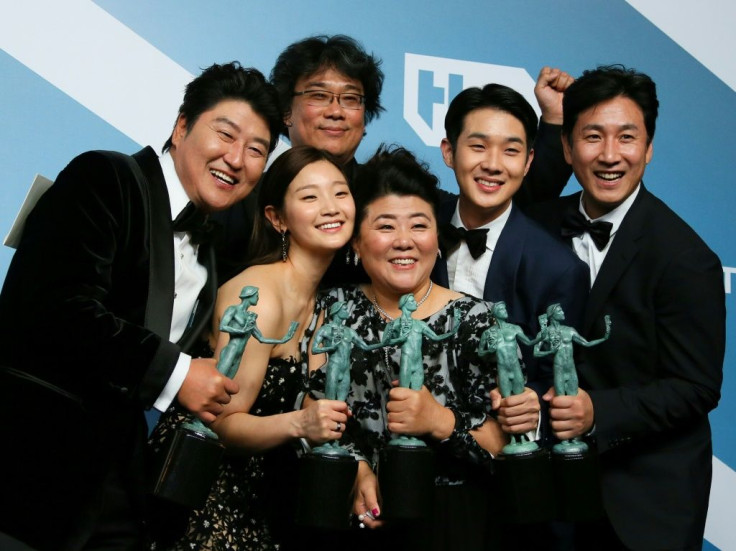 "Parasite" cast (L-R) Song Kang-ho, Cho Yeo-jeong, director Bong Joon-ho, Lee Jung-eun, Choi Woo-shik, and Lee Sun-kyun pose with their trophies for Outstanding Performance by a Cast in a Motion Picture during the SAG Awards in Los Angeles