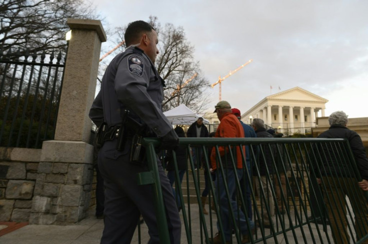 Virginia State Capitol police officers move barriers near one of the entrances to the State Capitol building in Richmond, ahead of a pro-gun rights rally