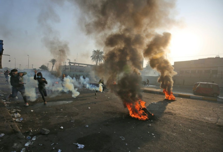 Anti-government protesters tried Monday to block central Baghdad streets with burning tyres