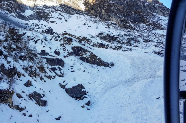 View from a helicopter of the avalanche site. Drones have also been deployed in the search, which has been hampered by deep snow